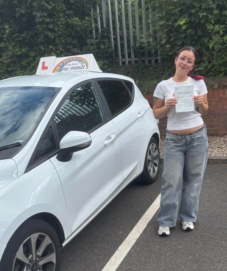 Rainbows Driving School pupil beside the learner car